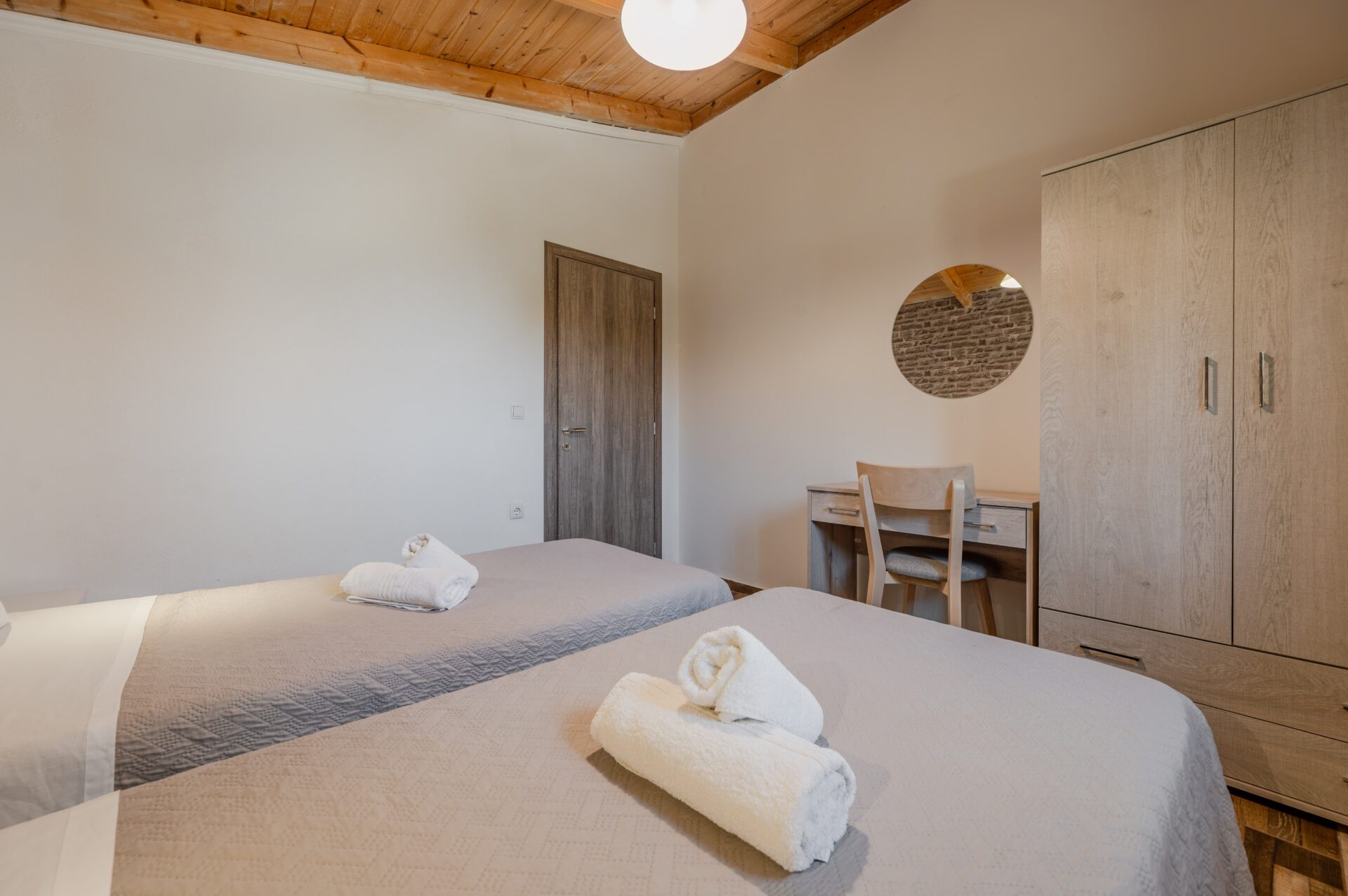 Cozy sitting corner with decorative items and view of the courtyard.